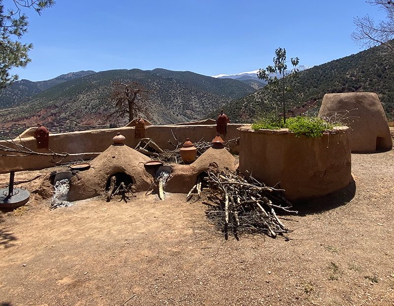 An off-road electric scooter parked beside a Berber village track in Ourika