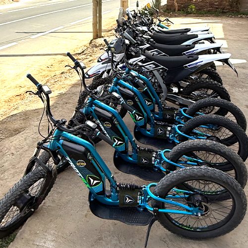 Off-road electric scooters lined up before the start of an Ourika ride