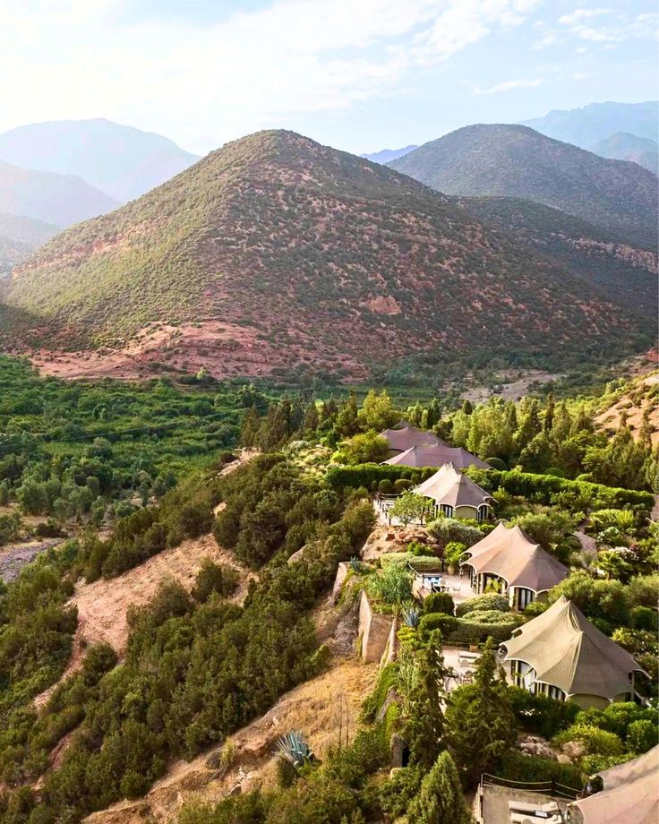 Berber tents on the hillside at Kasbah Tamadot, each with a private terrace facing the High Atlas mountains