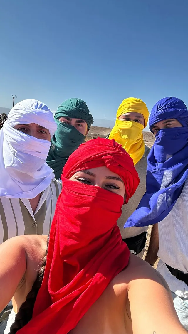 A group of travellers in colourful Berber turbans on an Agafay desert day trip