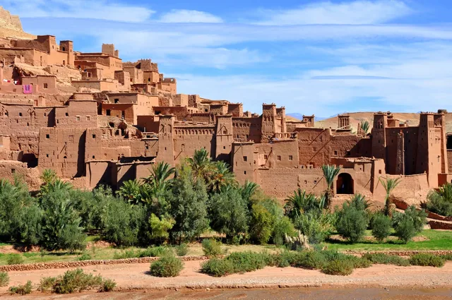 The earthen towers of the Aït Ben Haddou ksar rising above palm and olive gardens