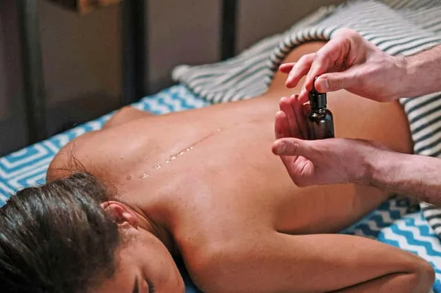 Argan oil back massage on a treatment table