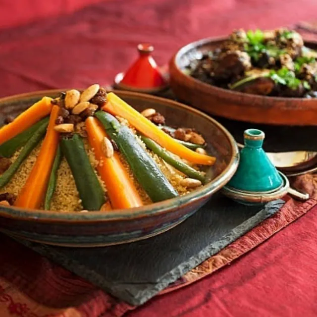 Moroccan couscous and tagine served together for a desert dinner