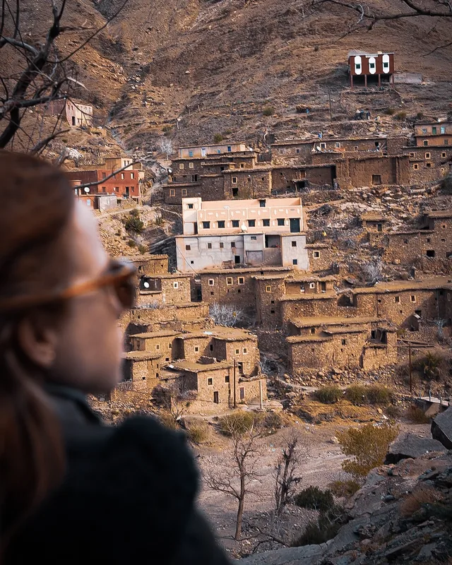 A stone and earth Berber village stacked up a steep High Atlas hillside